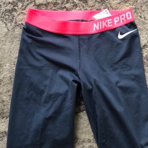 Navy and pink Nike pro tights